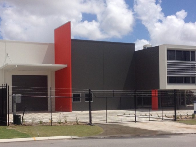 Red and grey painted commercial warehouse unit exterior