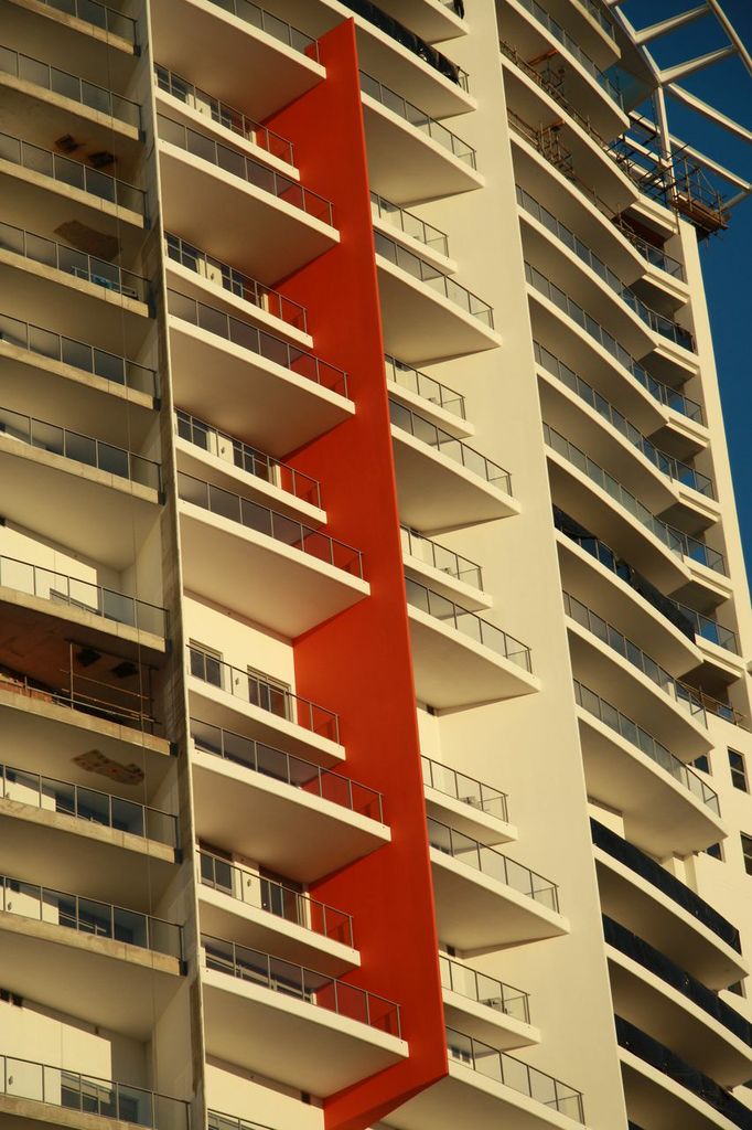 Large apartment complex painted cream and red