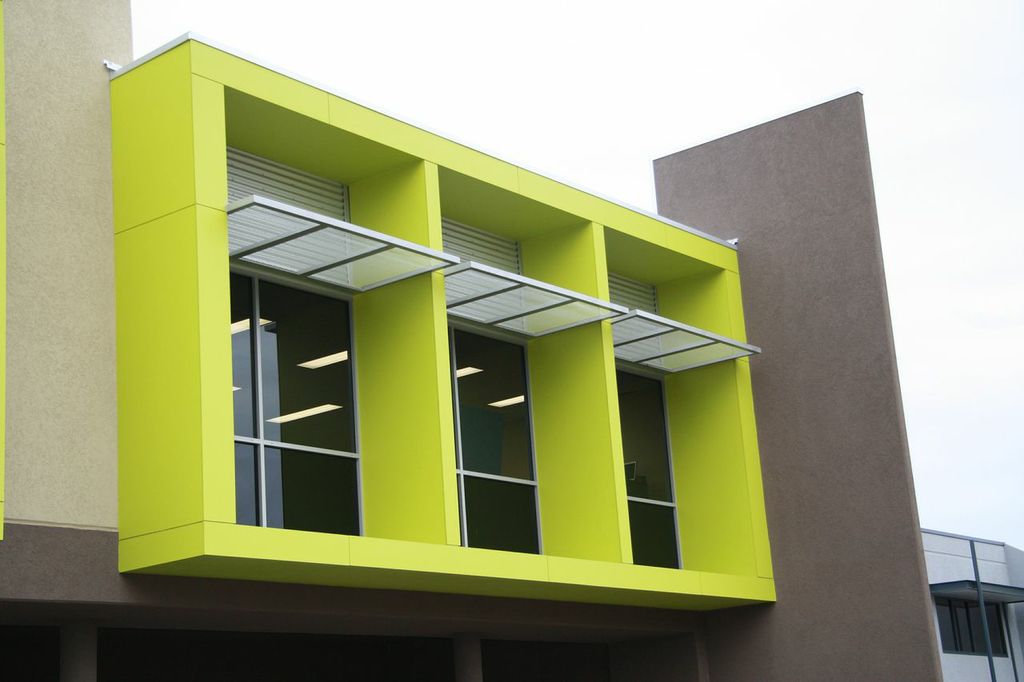 Exterior of office building, painted in vibrant lime green
